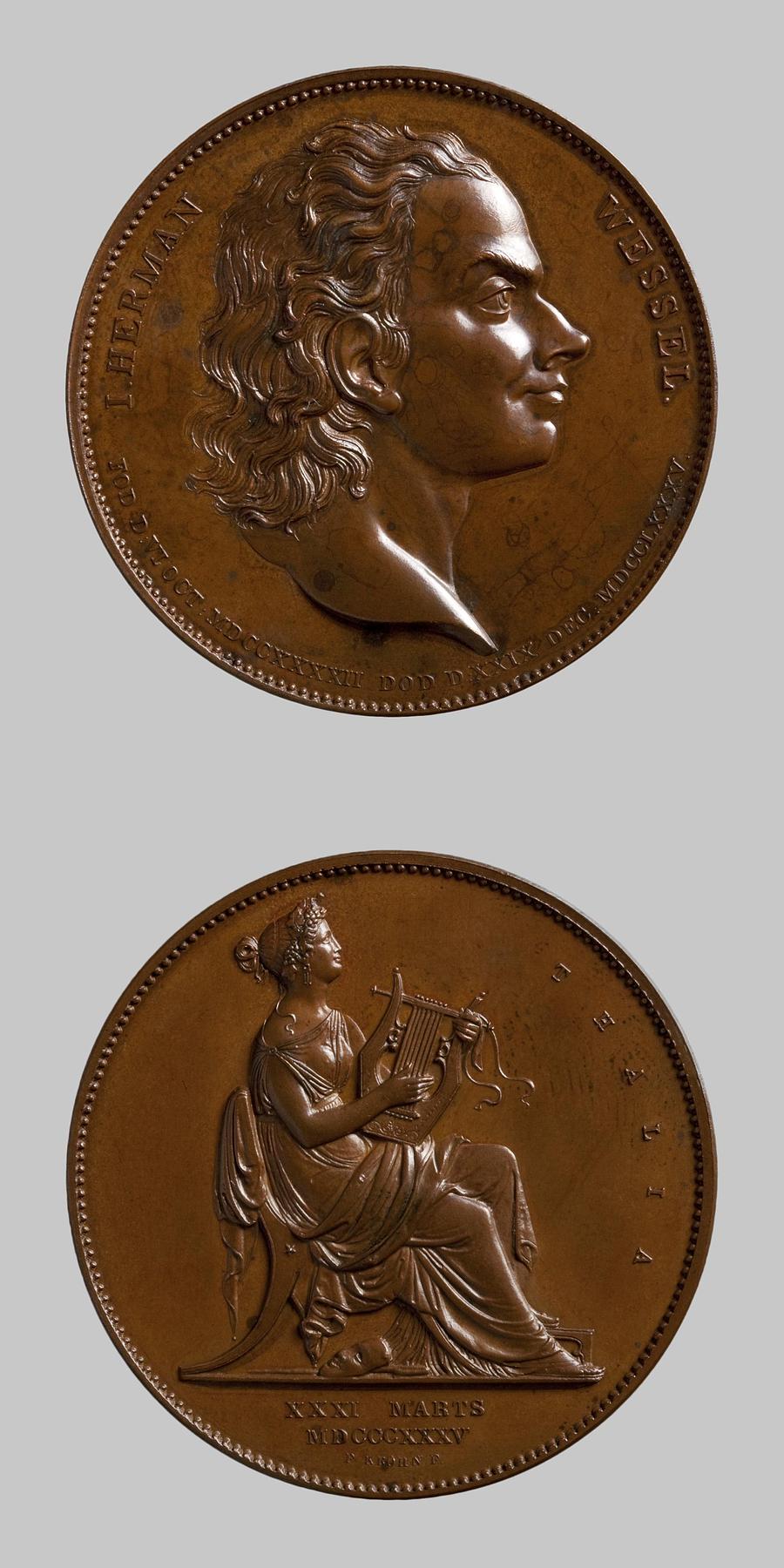 Medaljens forside: Johann Herman Wessel. Medaljens bagside: Komediens muse, F97