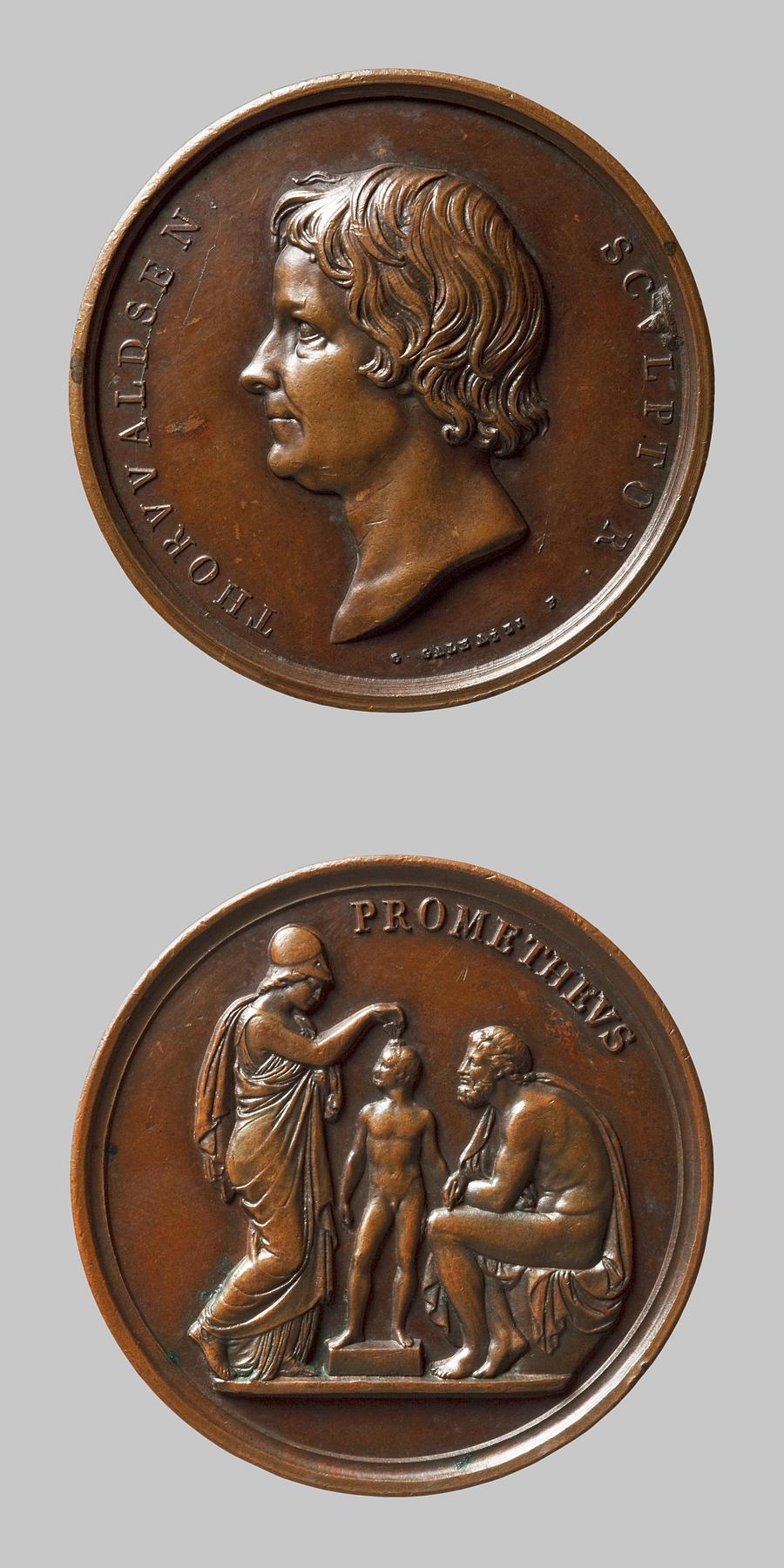 Medaljens forside: Portræt af Thorvaldsen. Medaljens bagside: Minerva og Prometheus, F148