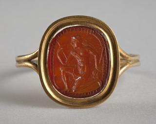 I77 Såret knælende amazone med økse og skjold