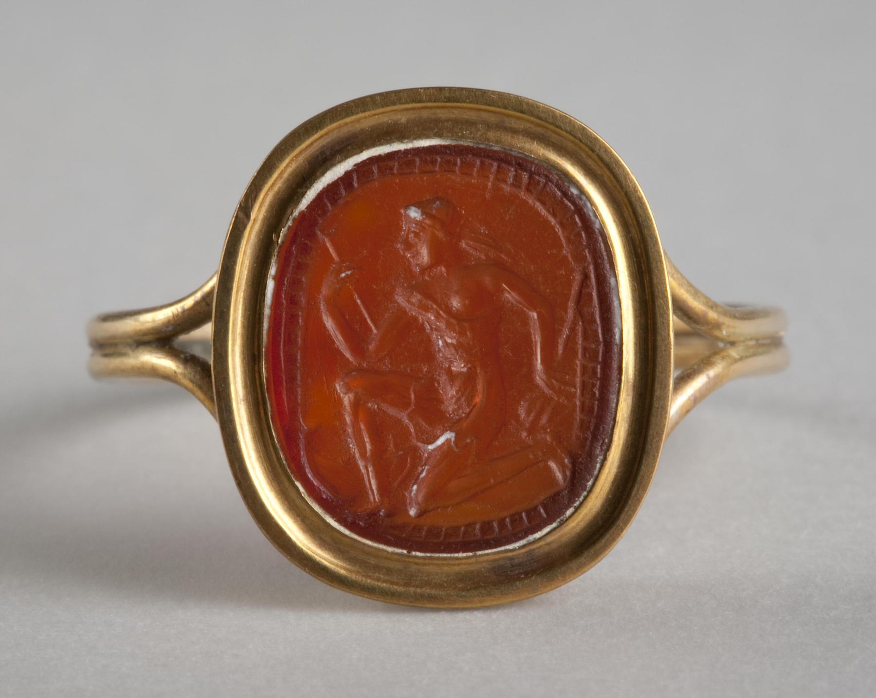 Såret knælende amazone med økse og skjold, I77