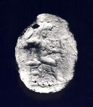 I83 Enthroned man with a sickle