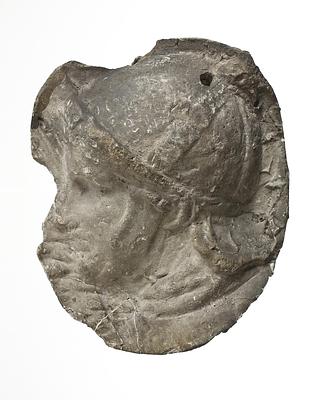 L326ø Head of a helmeted legionary