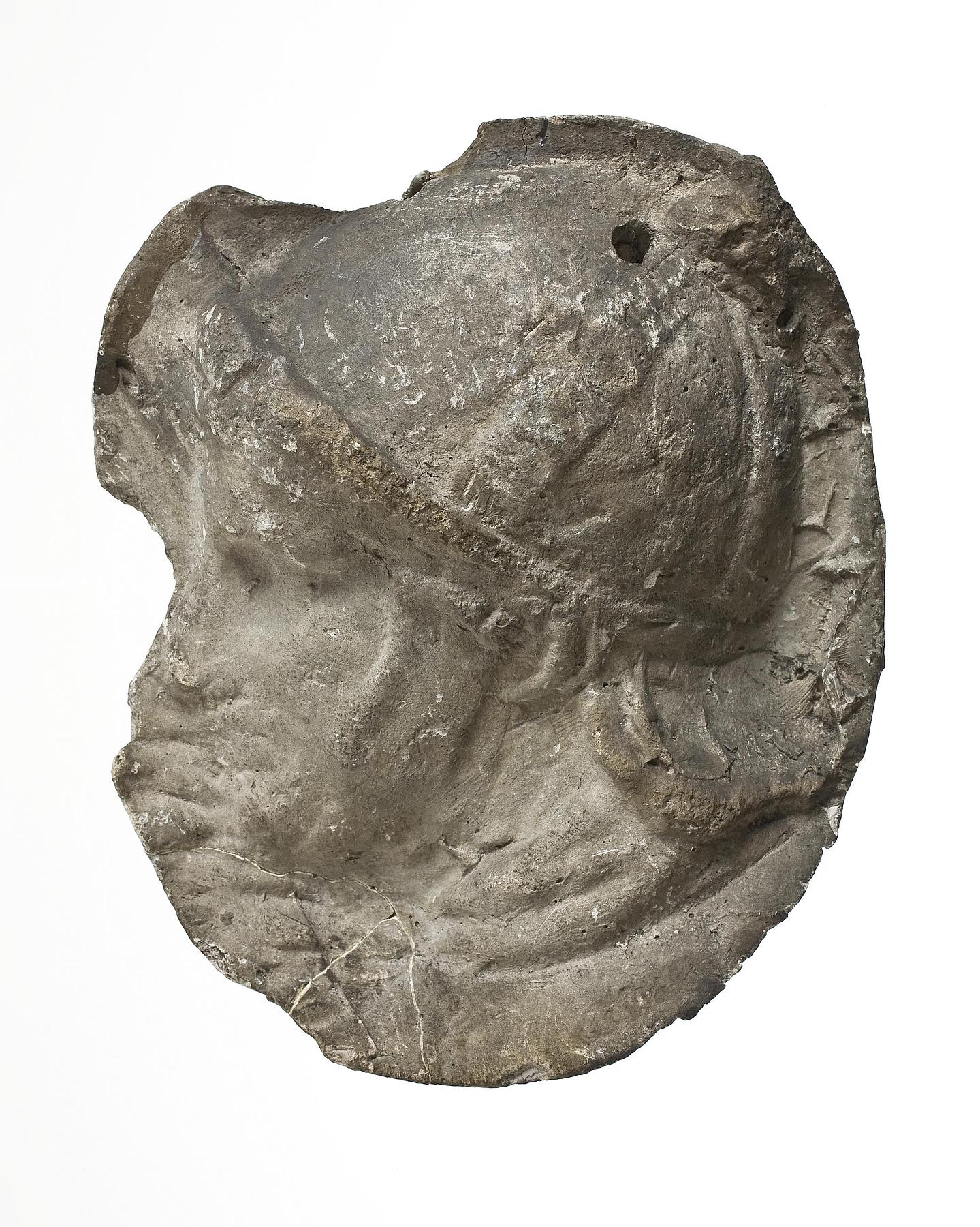 Head of a helmeted legionary, L326ø