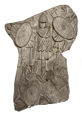 L322c Relief with trophy of Dacian weapons