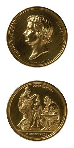 F7 Medaljens forside: Portræt af Thorvaldsen. Medaljens bagside: Minerva og Prometheus