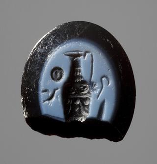 I1104 Jug decorated in relief, a sacrificial bowl, a sacrificial knife, a bird, and an augur's staff