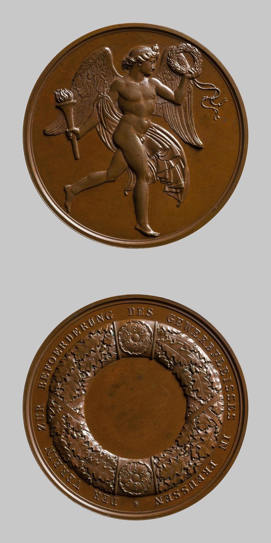 Medaljens forside: Genie med krans og fakkel. Medaljens bagside: Egekrans, F135