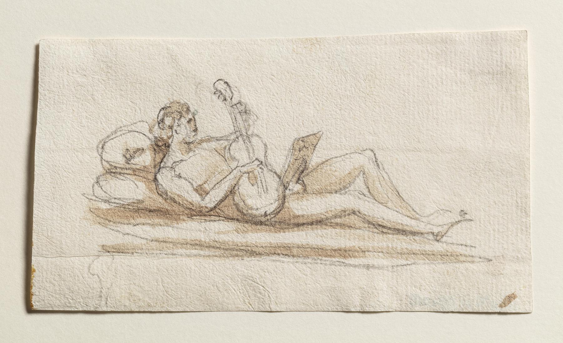 Reclining male figure playing the guitar, C903