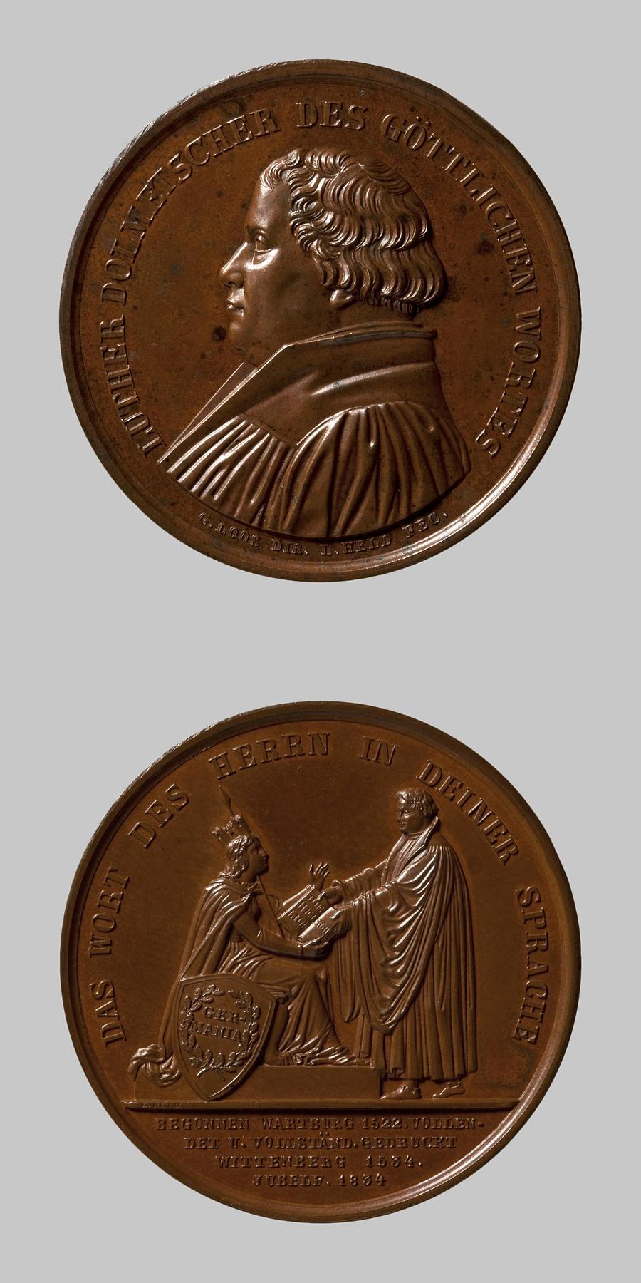 Medaljens forside: Martin Luther. Medaljens bagside: Martin Luther overrækker Germania sin tyske Bibeloversættelse, F91