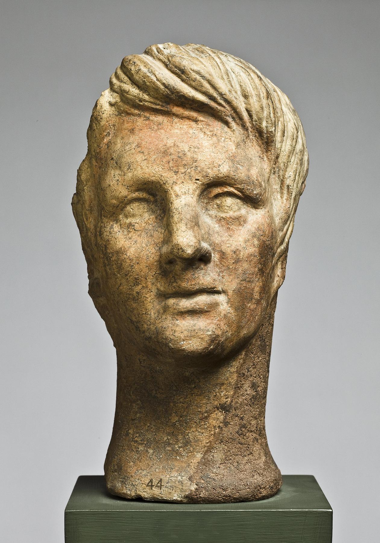 Votive head of youth, H1044