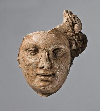 H1041 Relief (?) with a female head