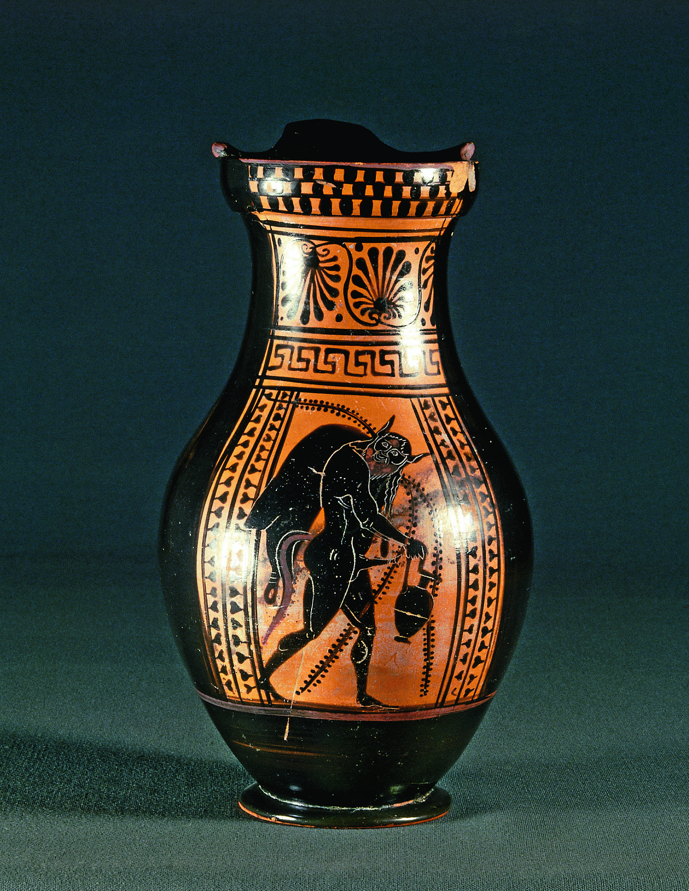 Olpe with a silenus carrying a jug and a wineskin, H526