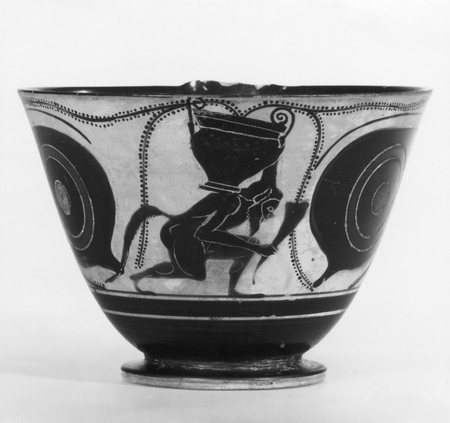Kyathos with sirens, eyes, and a silenus, carrying a krater and a drinking horn, H527