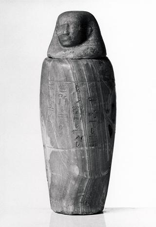 H389 Canopic jar with human-headed lid and hieroglyphic inscription