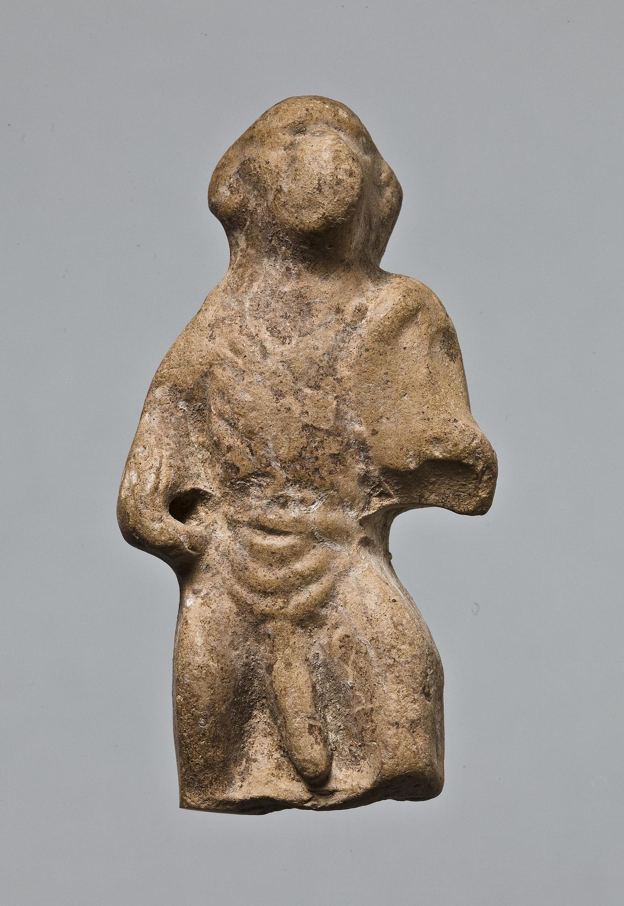 Statuette of a standing monkey holding a shield, H1052