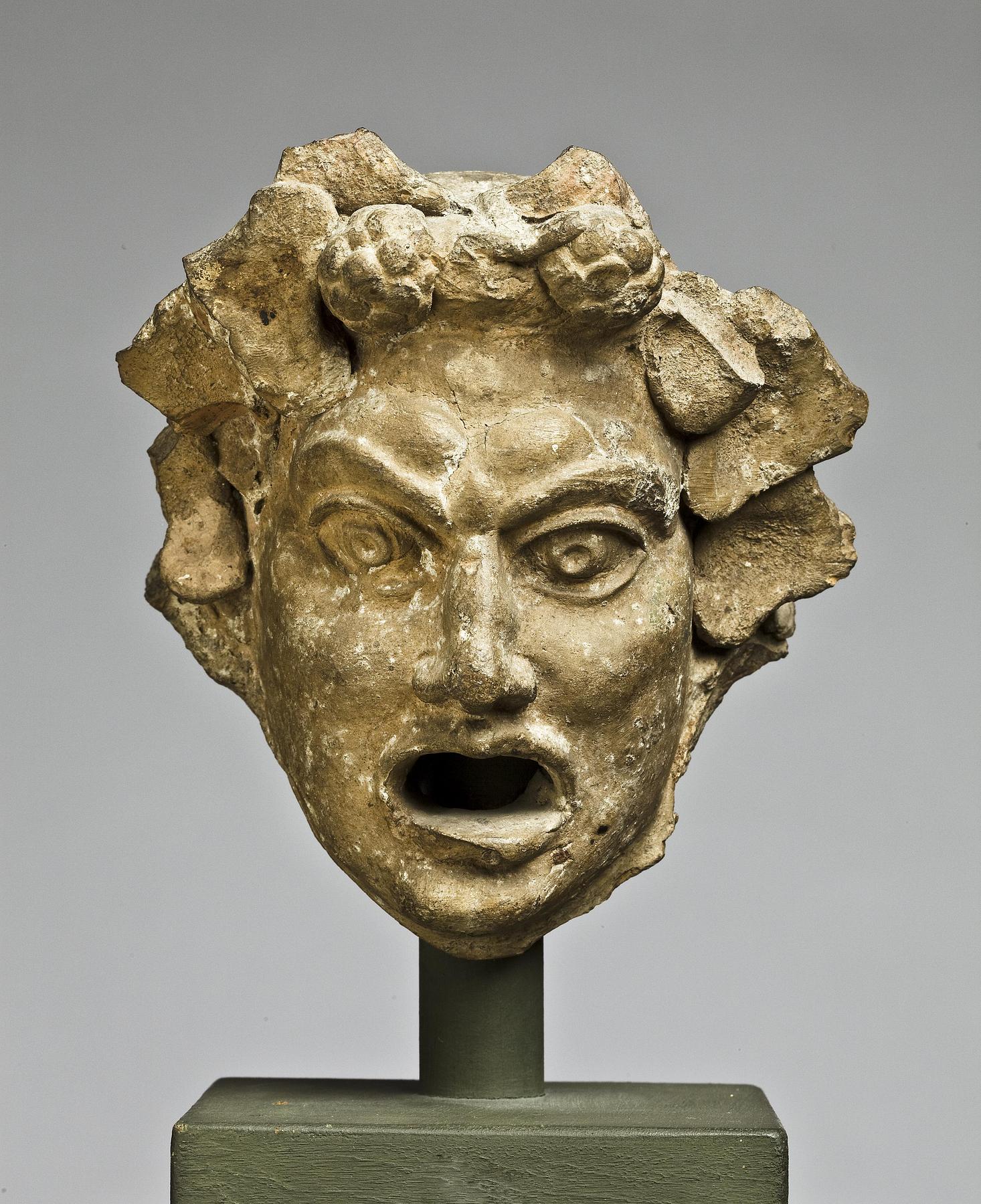 Water spout in the shape of a theatre mask, H1055