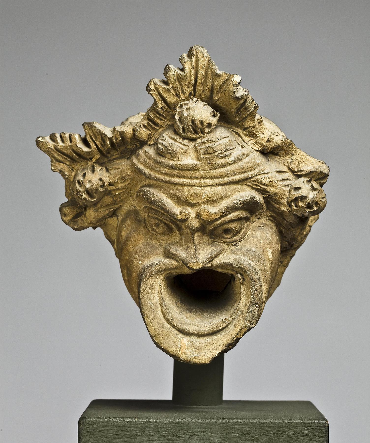 Water spout in the shape of a theatre mask, H1053