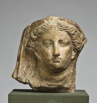 H1062 Antefix in the shape of a female head