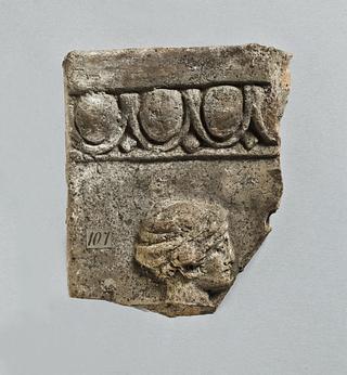H1107 Campana relief with female head wearing a close-fitting cap (kekryphalos)