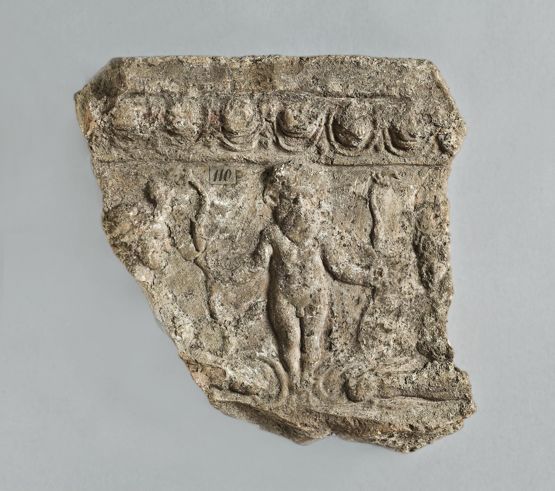 Campana relief with a small bearded and crowned male figure (Bes) flanked by two reclining sphinxes, H1110