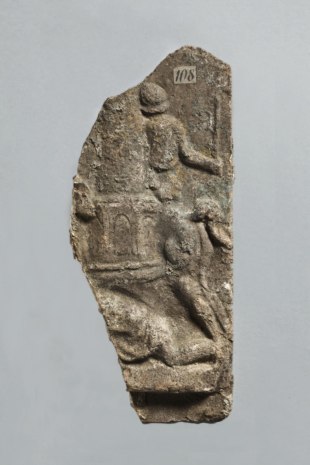 Campana relief with horse and horseman passing a meta, and below them a reclining figure, H1108