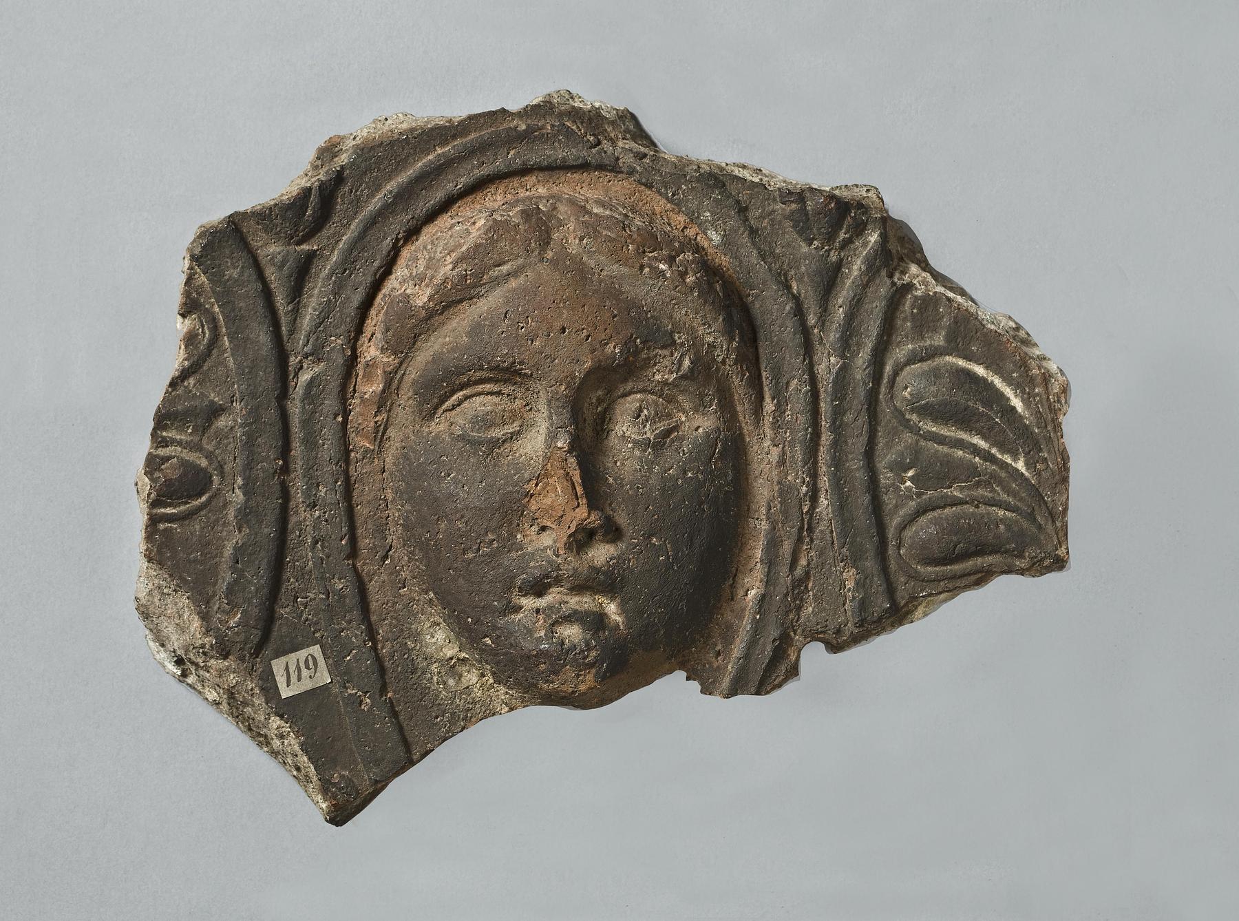 Architectural relief with female mask, H1119