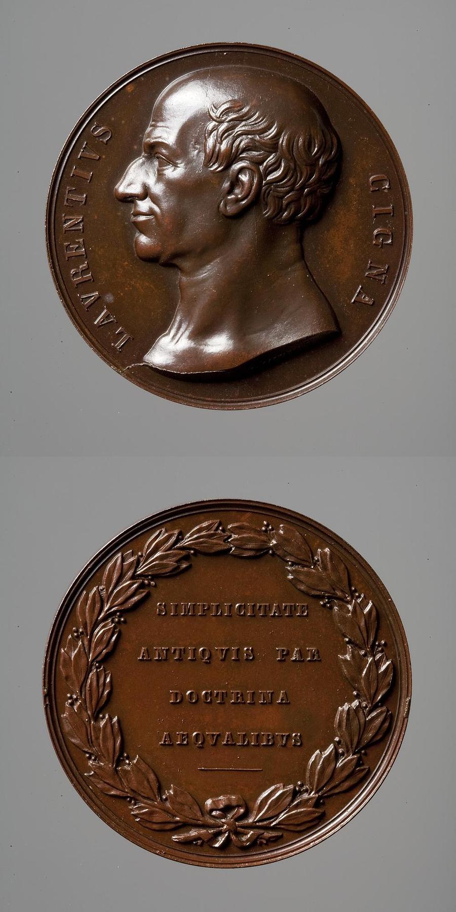 Medaljens forside: Larentius Cigna. Medaljens bagside: Laurbærkrans og inskription, F67