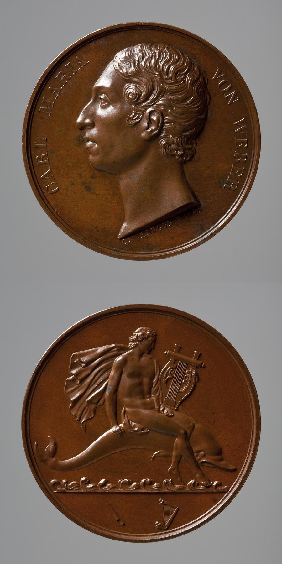 Medaljens forside: Carl Maria von Weber. Medaljens bagside: Arion på delfinen, F99