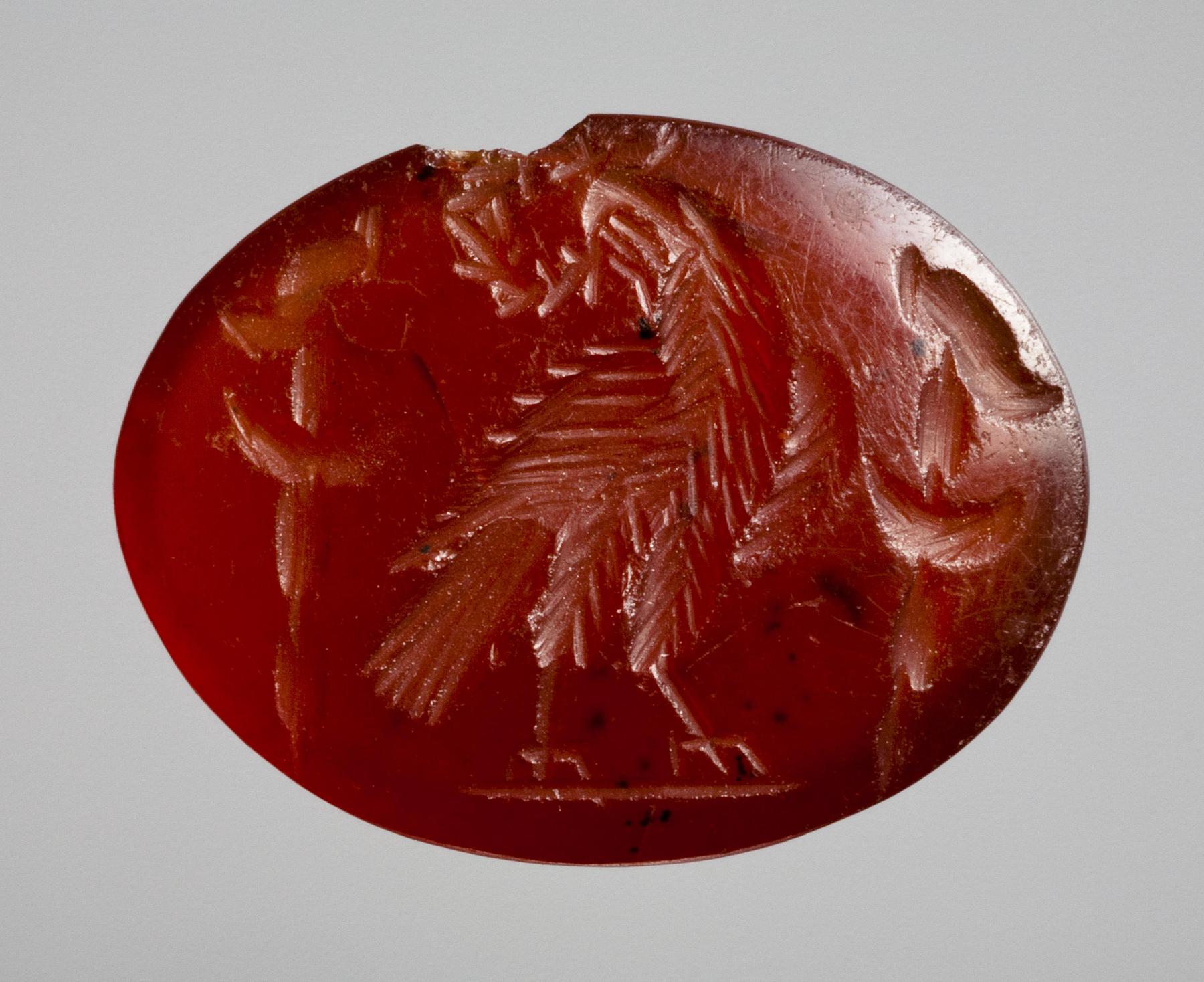 Eagle with a wreath in its beak seated between two military standards, I120