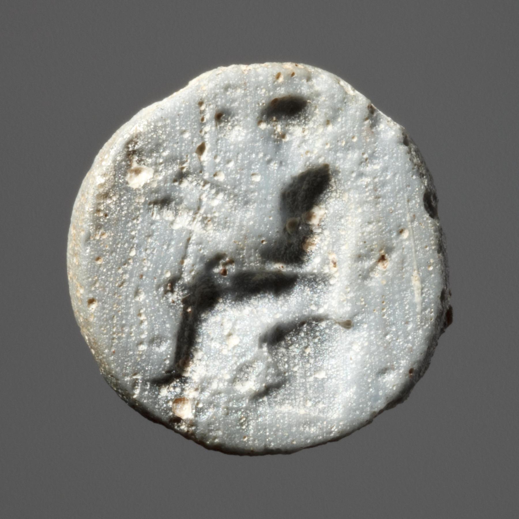 Seated man reading, I1202