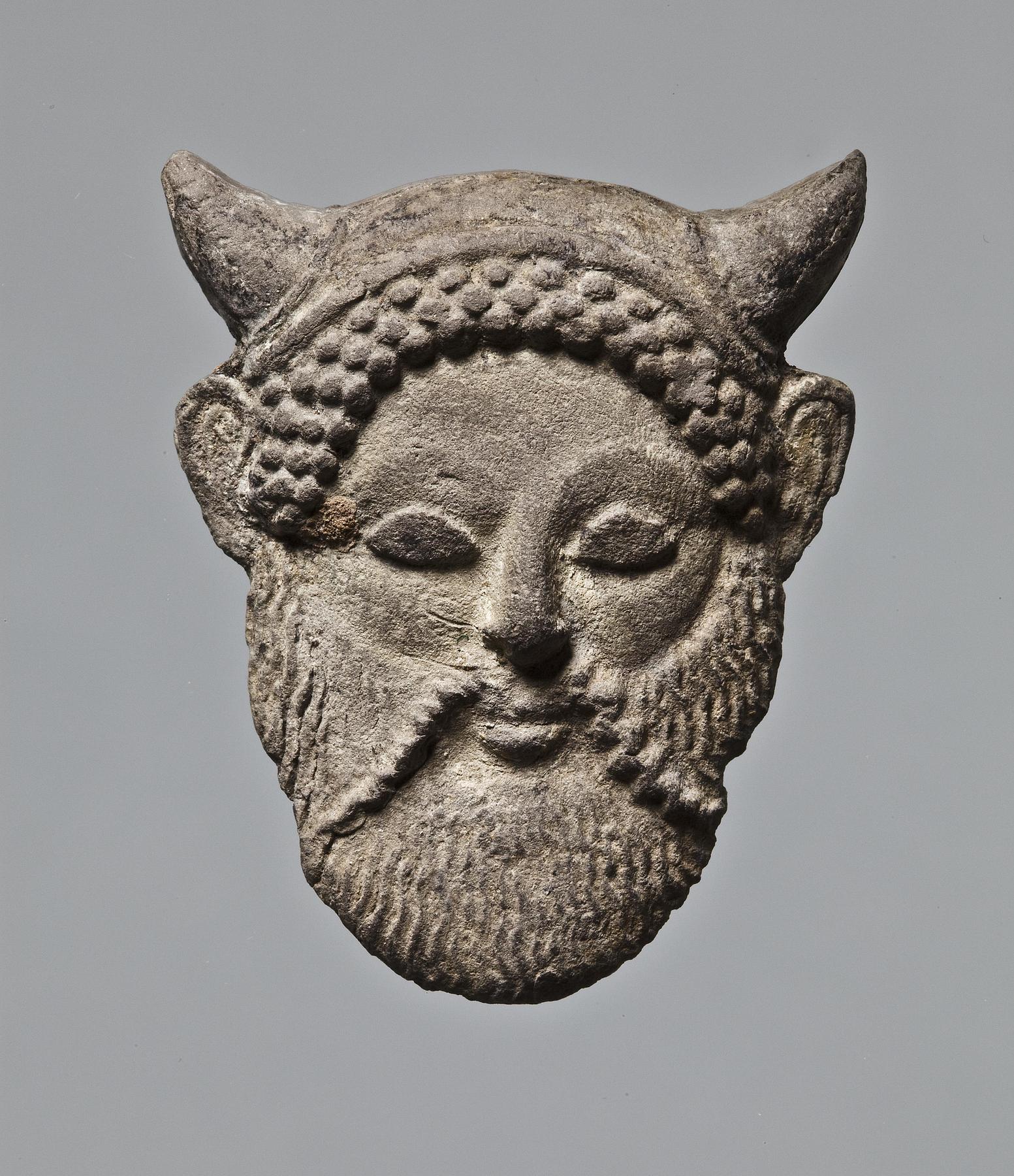 Appliqué in the shape of an Acheloos mask, H1271