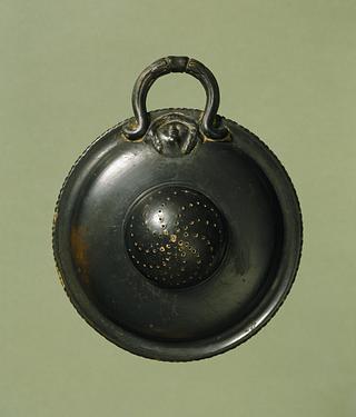 H771 Strainer with relief decoration of a female head