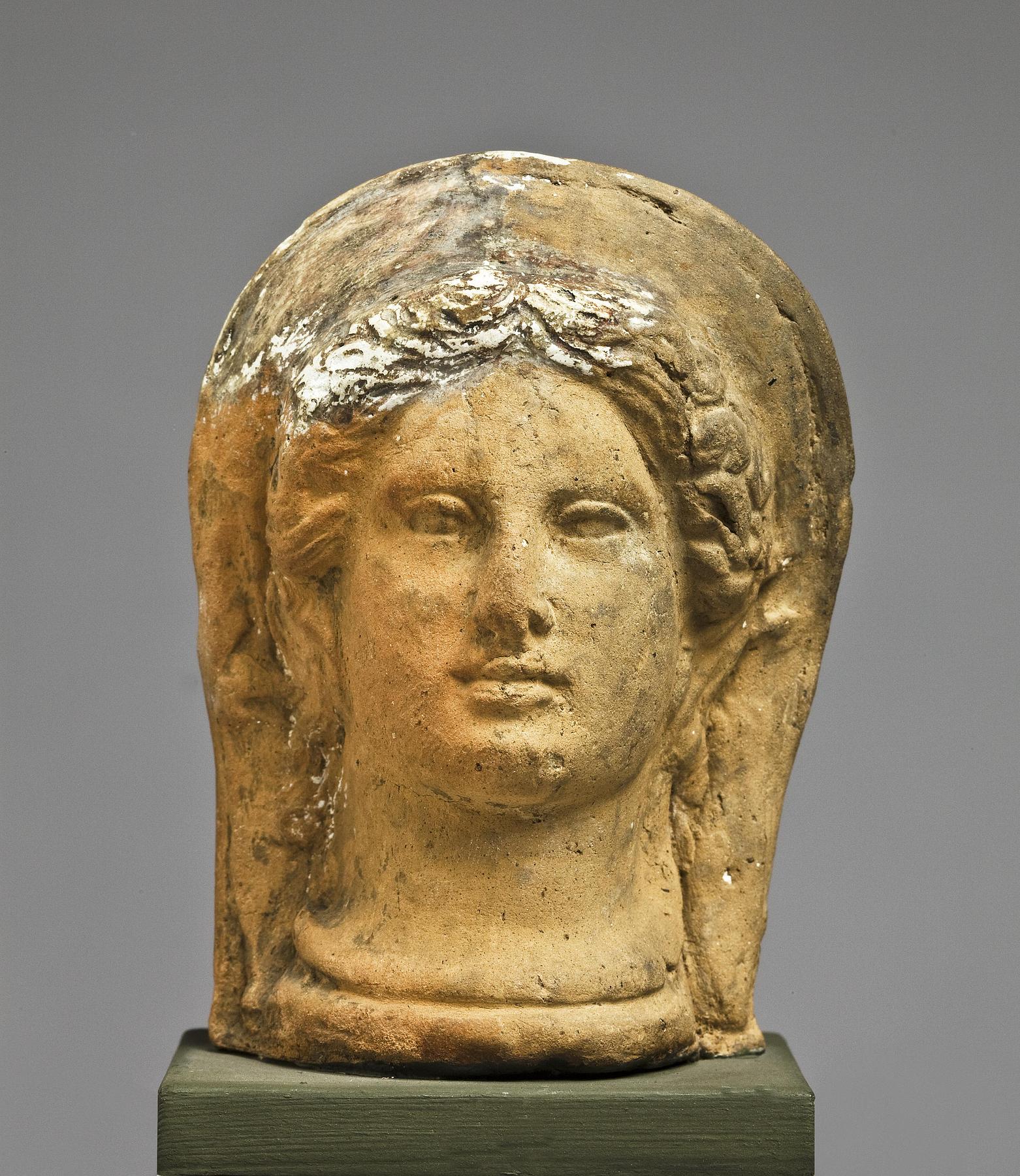 Votive head of a woman, H1007