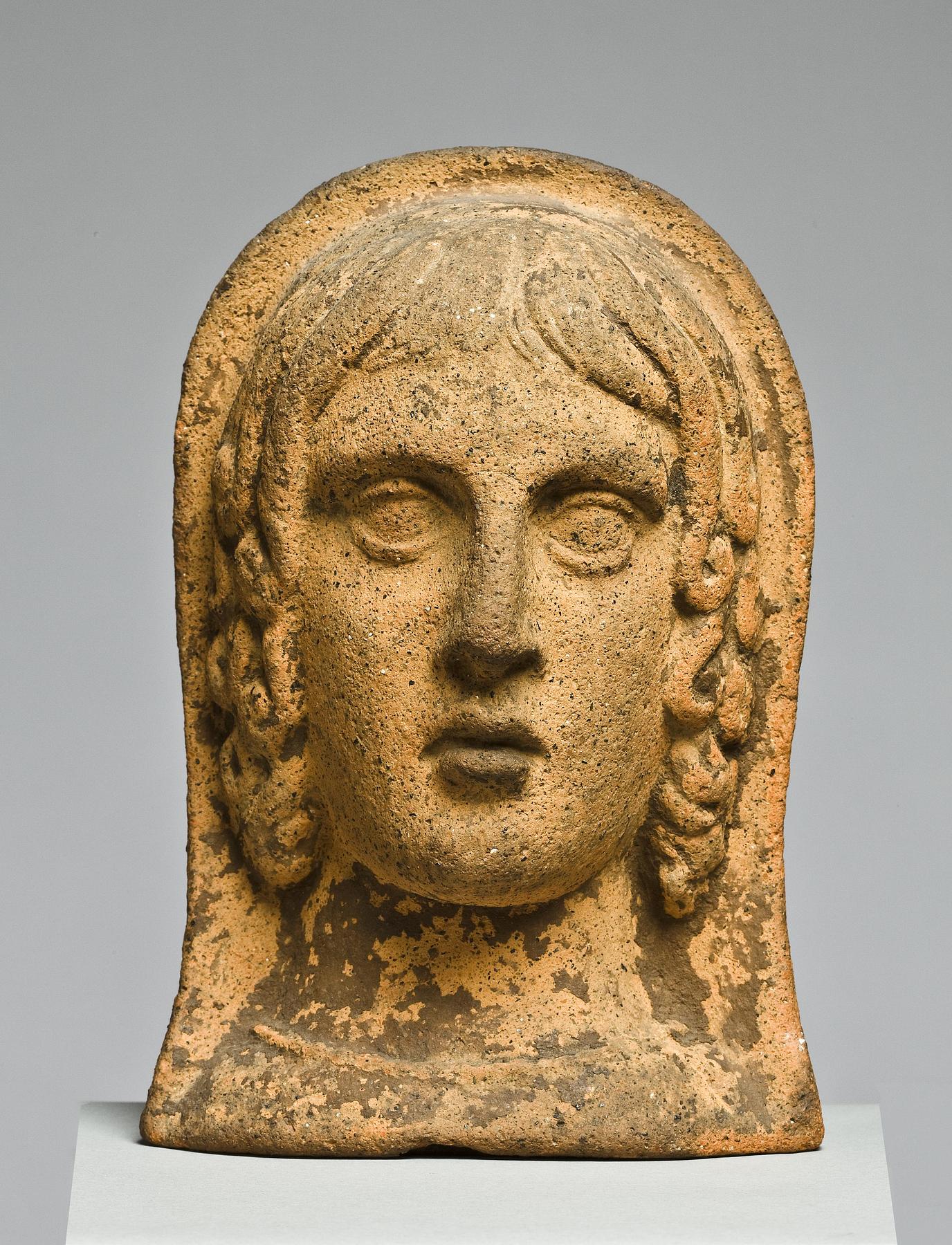 Votive head of a woman, H1006