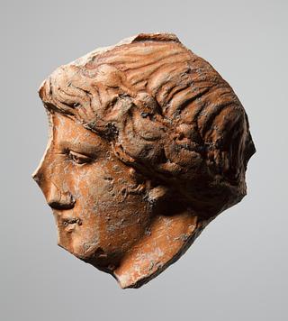 H798 Vessel (?) with relief decoration of a female head in profile