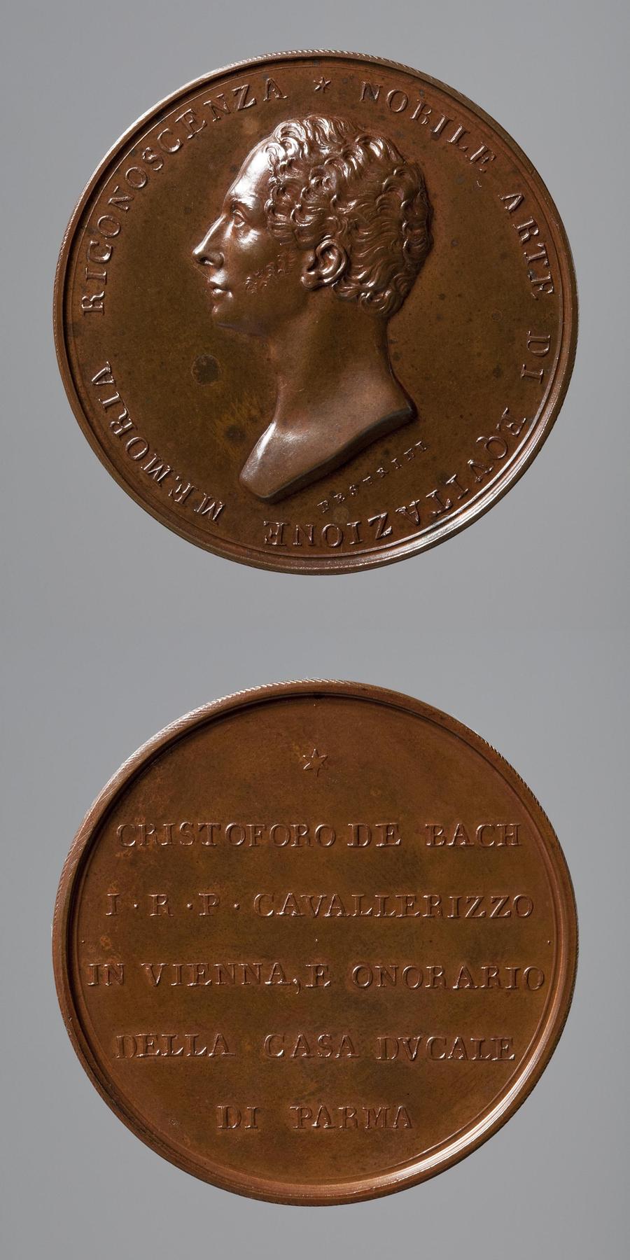 Medaljens forside: Staldmester C. Bach. Medaljens bagside: Inskription, F107