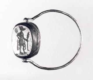 I56 Emblem of Isis (obverse), Anubis with a palm branch and heraldic staff (reverse)