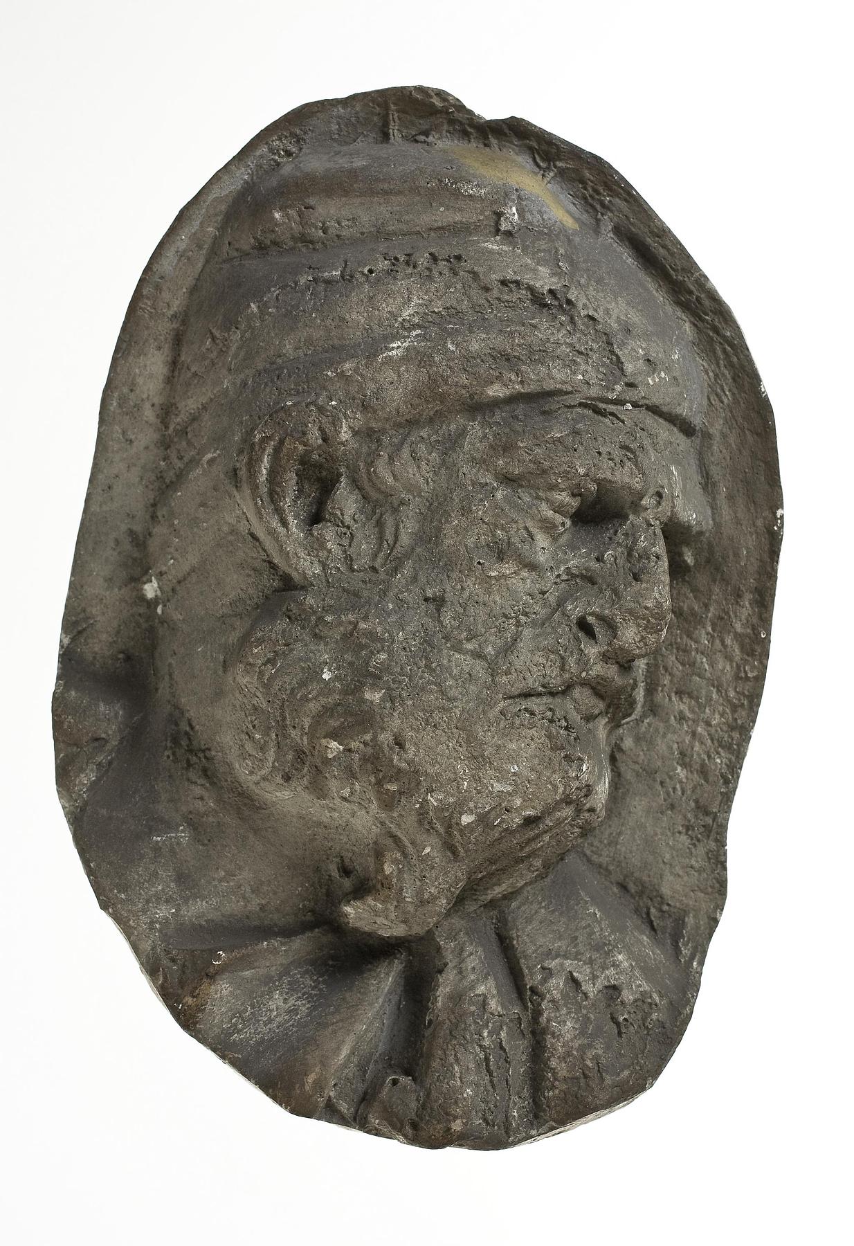 Heads of Dacian warriors wearing caps, L331f