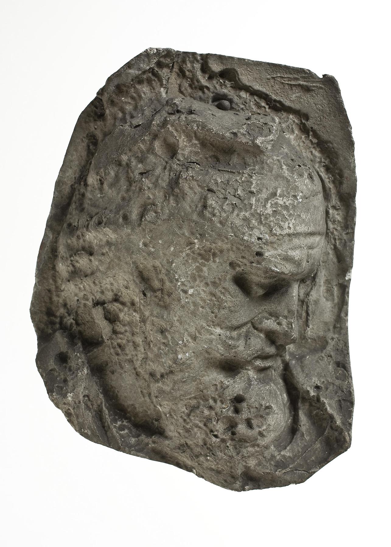 Heads of Dacian warriors wearing caps, L331e