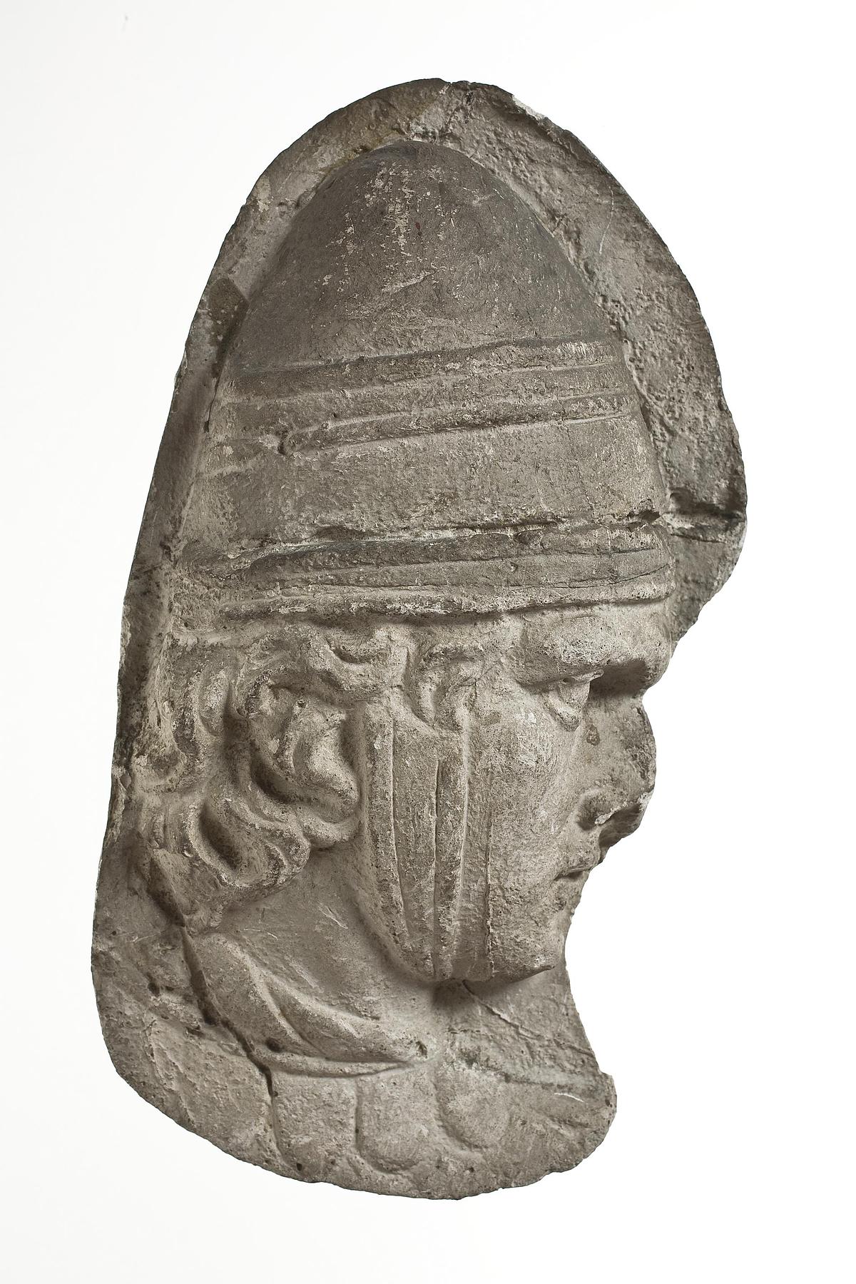 Heads of Sarmatian horsemen wearing conical helmets, L333d