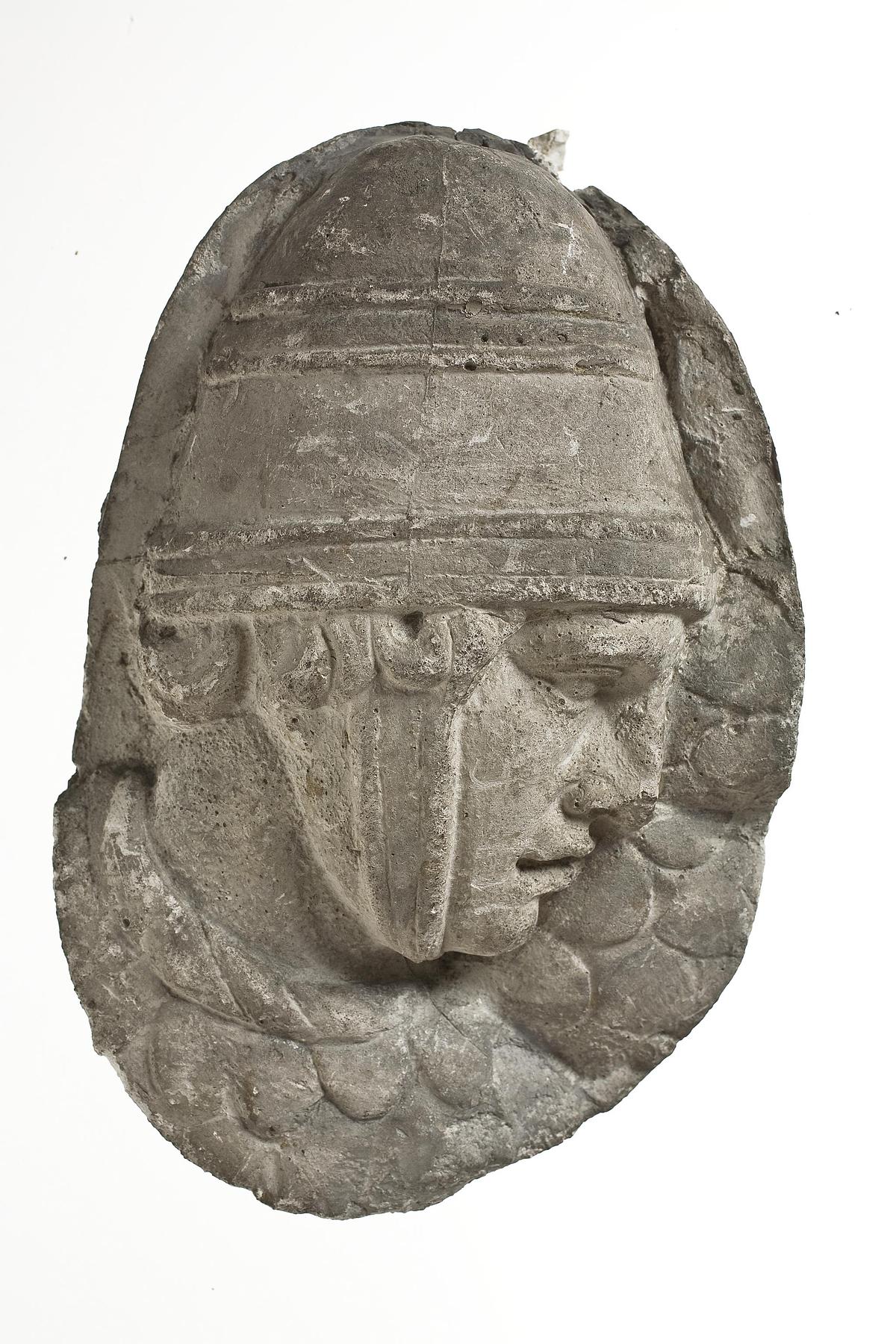 Heads of Sarmatian horsemen wearing conical helmets, L333c