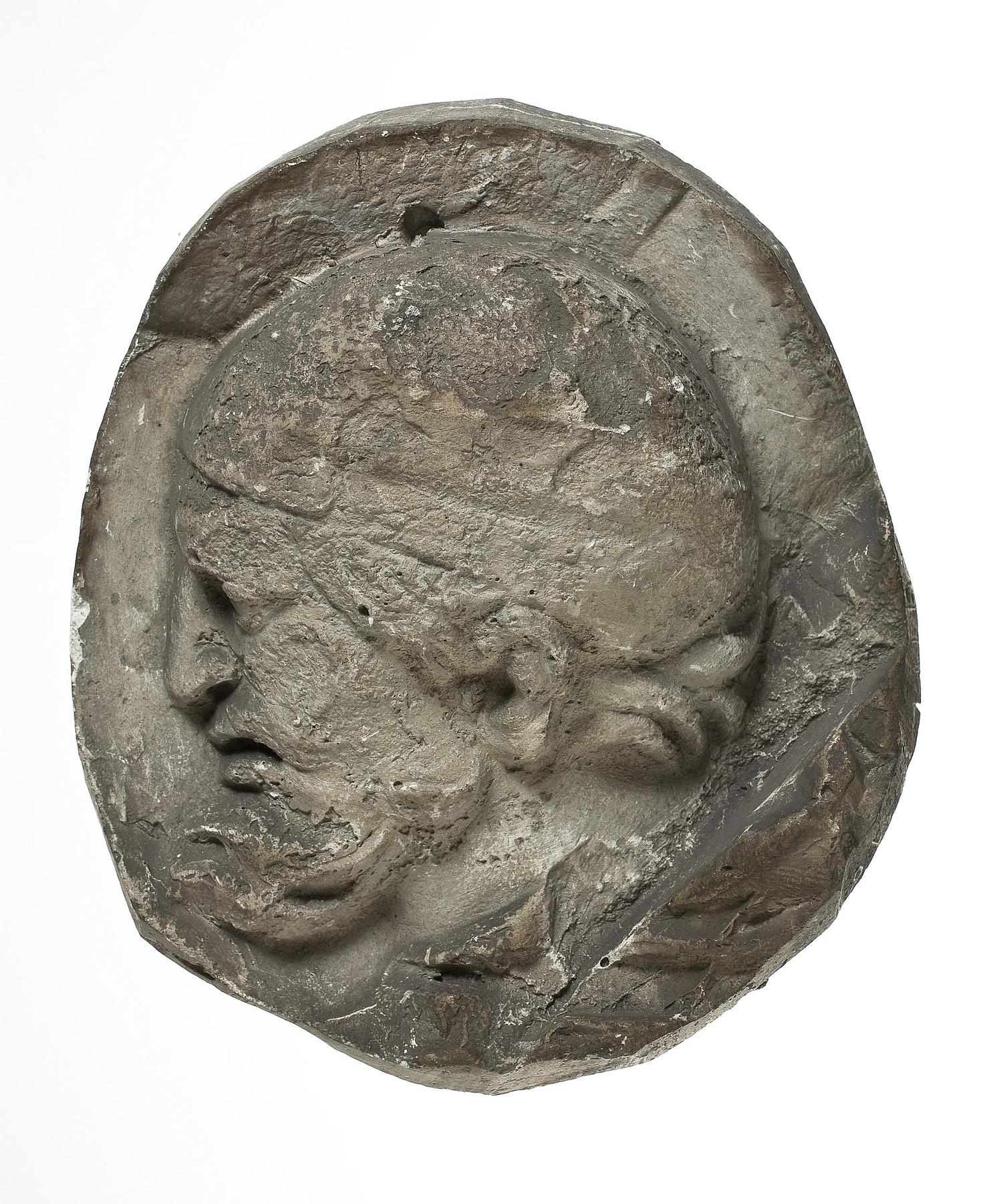 Heads of Dacian warriors wearing caps, L331o