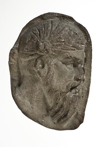 L331g Heads of Dacian warriors wearing caps