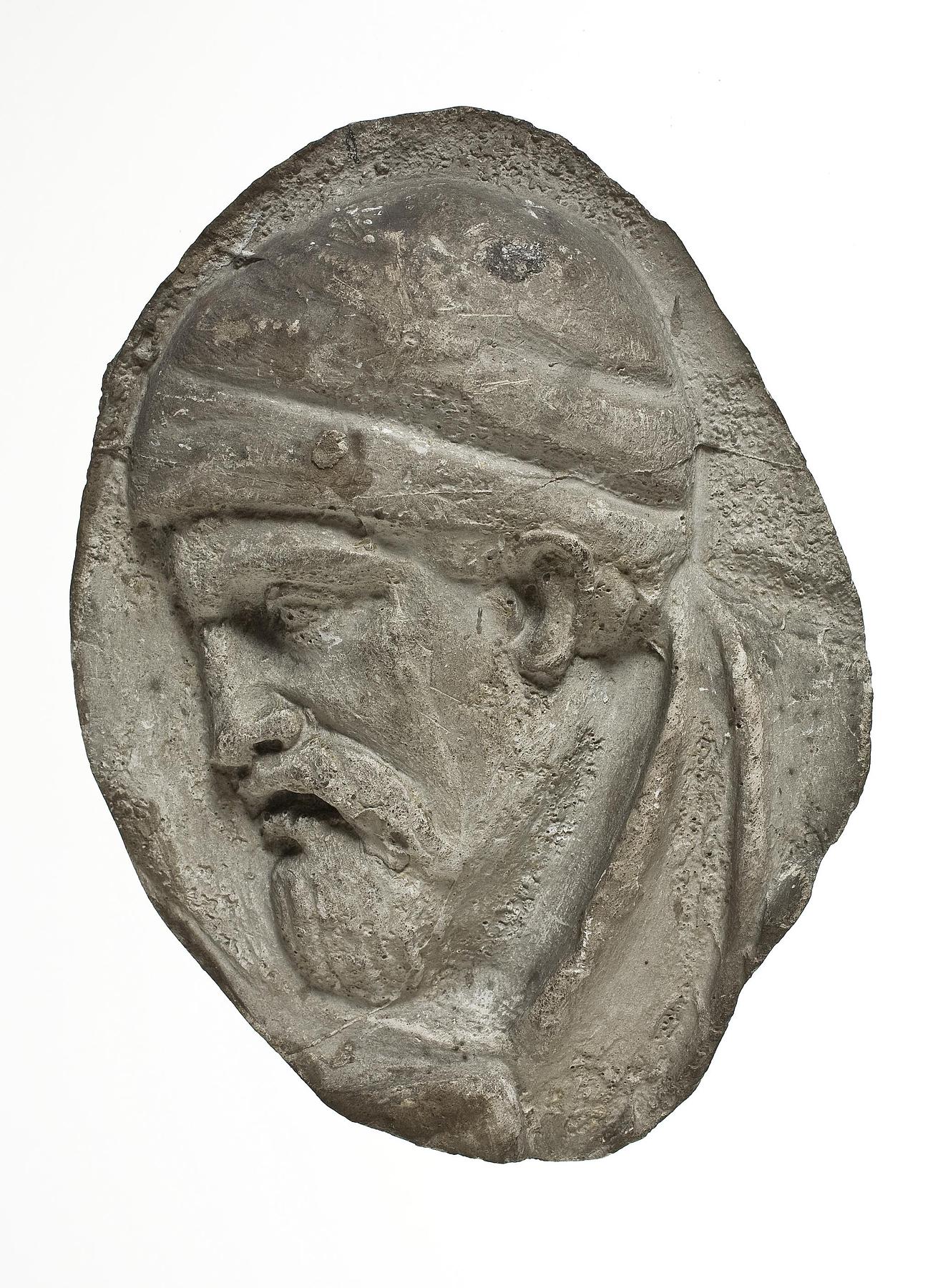 Heads of Dacian warriors wearing caps, L331i