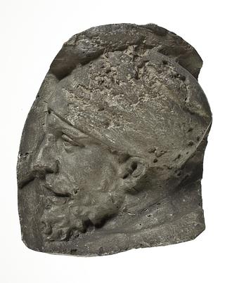 L331q Heads of Dacian warriors wearing caps