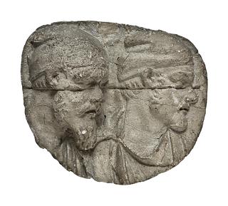 L331h Heads of Dacian warriors wearing caps
