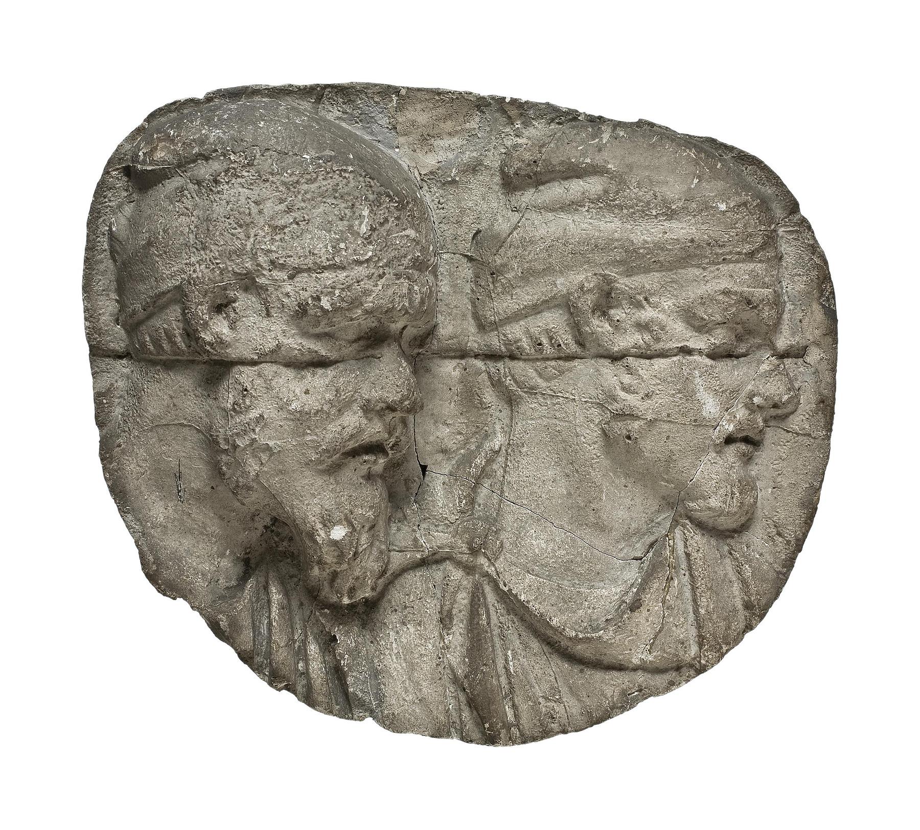 Heads of Dacian warriors wearing caps, L331h