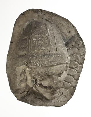 L333b Heads of Sarmatian horsemen wearing conical helmets