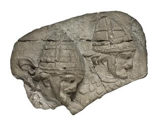 L333a Heads of Sarmatian horsemen wearing conical helmets