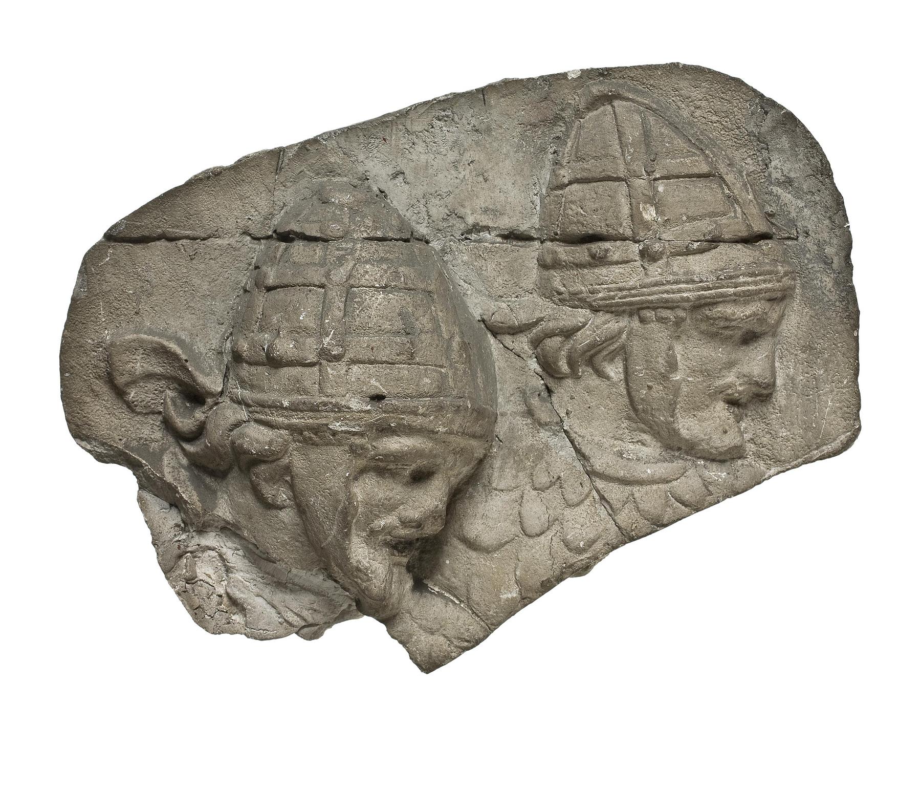 Heads of Sarmatian horsemen wearing conical helmets, L333a